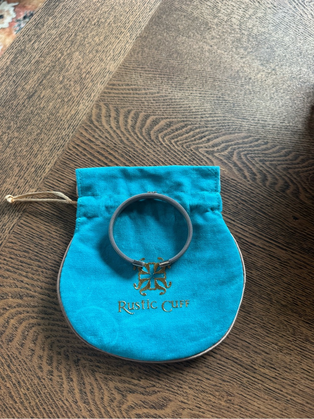 Rustic Cuff Silver Cuff Bracelet with Silver Emblem and blue bag